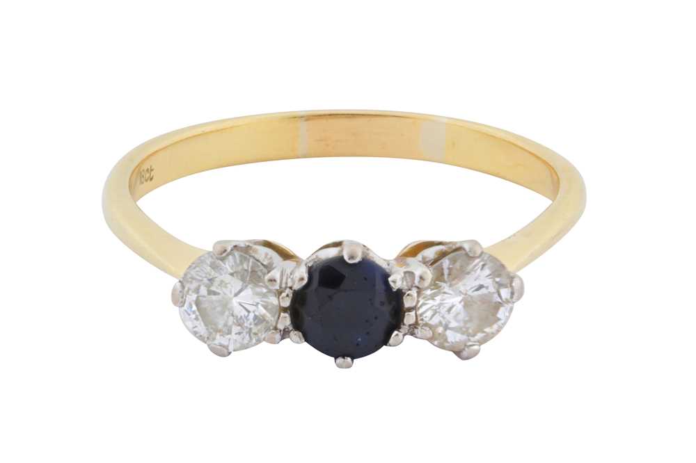 Lot 64 - A sapphire and diamond three stone ring