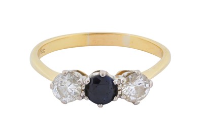 Lot 64 - A sapphire and diamond three stone ring