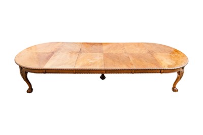 Lot 35 - A late Victorian figured walnut extending dining table by Maple & Co., circa 1890