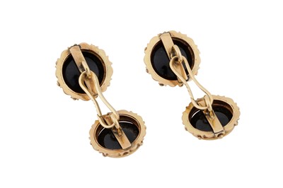 Lot 489 - A pair of onyx & diamond cufflinks
