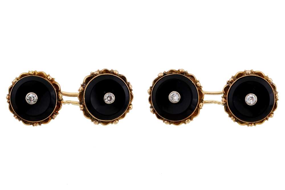 Lot 489 - A pair of onyx & diamond cufflinks