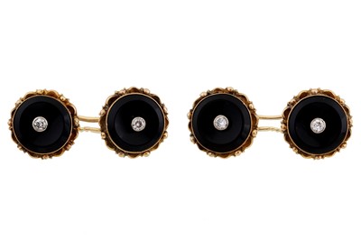 Lot 489 - A pair of onyx & diamond cufflinks