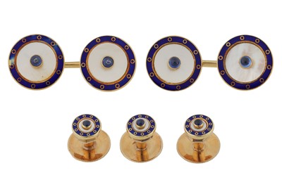 Lot 488 - A mother of pearl, sapphire and enamel dress set, circa 1984-1985