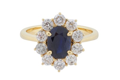 Lot 76 - A sapphire and diamond cluster ring