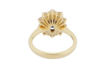 Lot 76 - A sapphire and diamond cluster ring