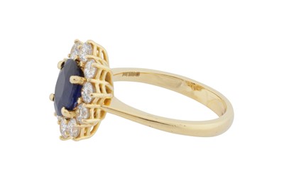 Lot 76 - A sapphire and diamond cluster ring