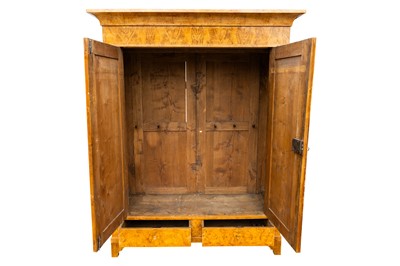 Lot 32 - A German Biedermeier ash armoire, Magdeburg, circa 1825