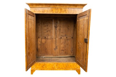 Lot 32 - A German Biedermeier ash armoire, Magdeburg, circa 1825