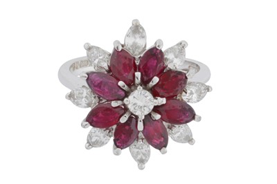 Lot 137 - A ruby and diamond cluster ring, circa 1976