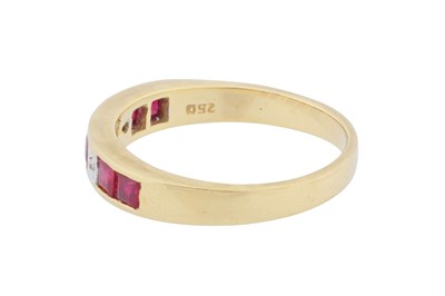 Lot 121 - A ruby and diamond band