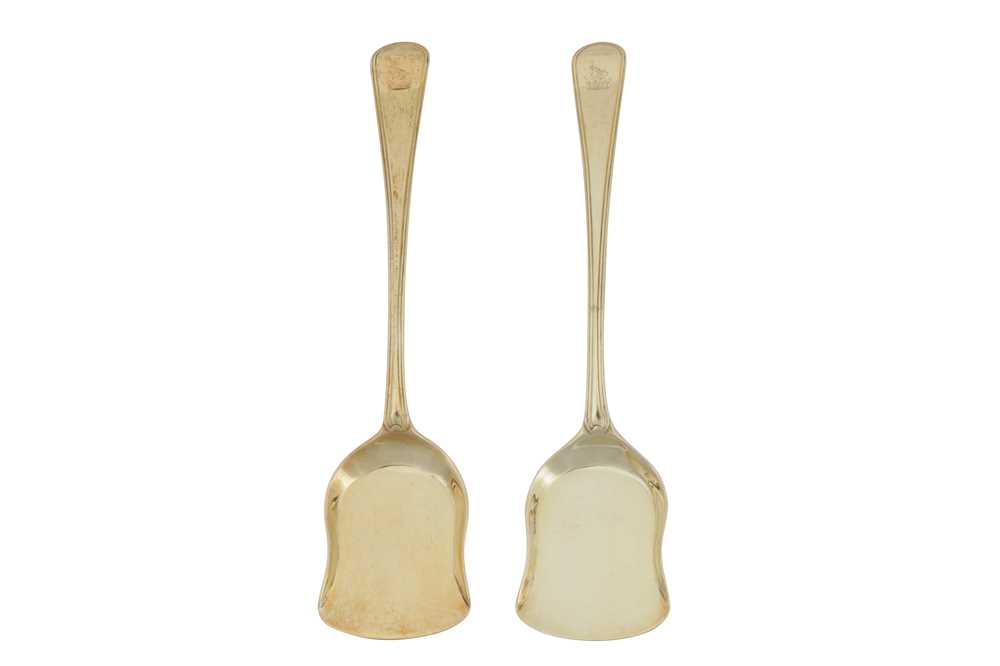 Lot 340 - Naval interest – A pair of George III sterling silver gilt ice cream spades or servers, London 1790 by George Smith and William Fearn