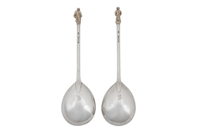 Lot 331 - A pair of Victorian sterling silver gilt apostle fruit serving spoons, London 1877 by Henry Holland
