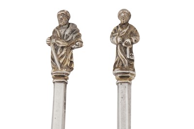 Lot 331 - A pair of Victorian sterling silver gilt apostle fruit serving spoons, London 1877 by Henry Holland