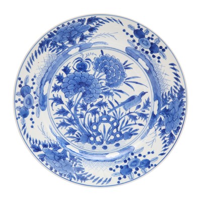 Lot 249 - A Chinese blue and white 'bird and peonies' dish, Qing dynasty, Kangxi period