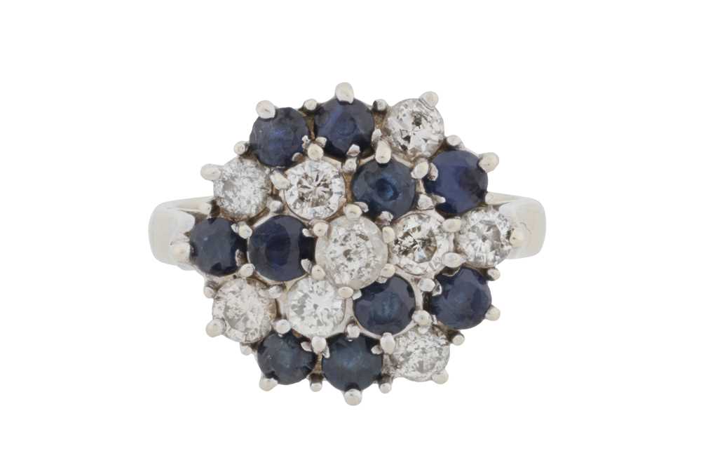 Lot 69 - A sapphire and diamond cluster ring