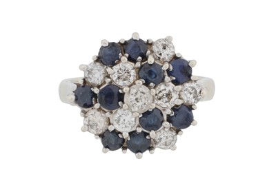 Lot 69 - A sapphire and diamond cluster ring