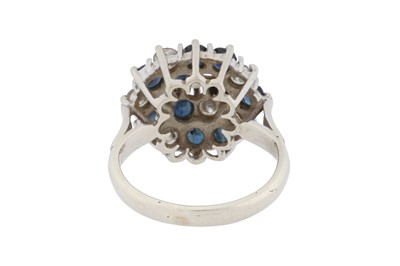Lot 69 - A sapphire and diamond cluster ring