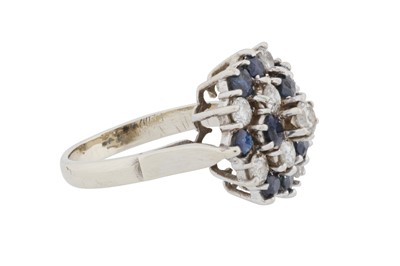 Lot 69 - A sapphire and diamond cluster ring