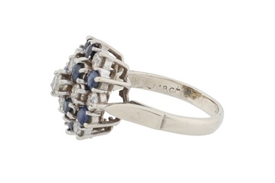Lot 69 - A sapphire and diamond cluster ring
