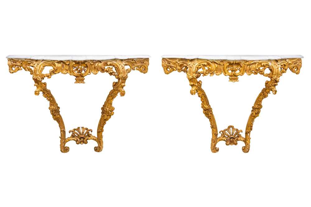 Lot 3 - A pair of 19th century Baroque revival marble topped giltwood and gesso console tables