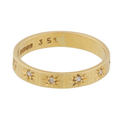 Lot 115 - A diamond half eternity ring