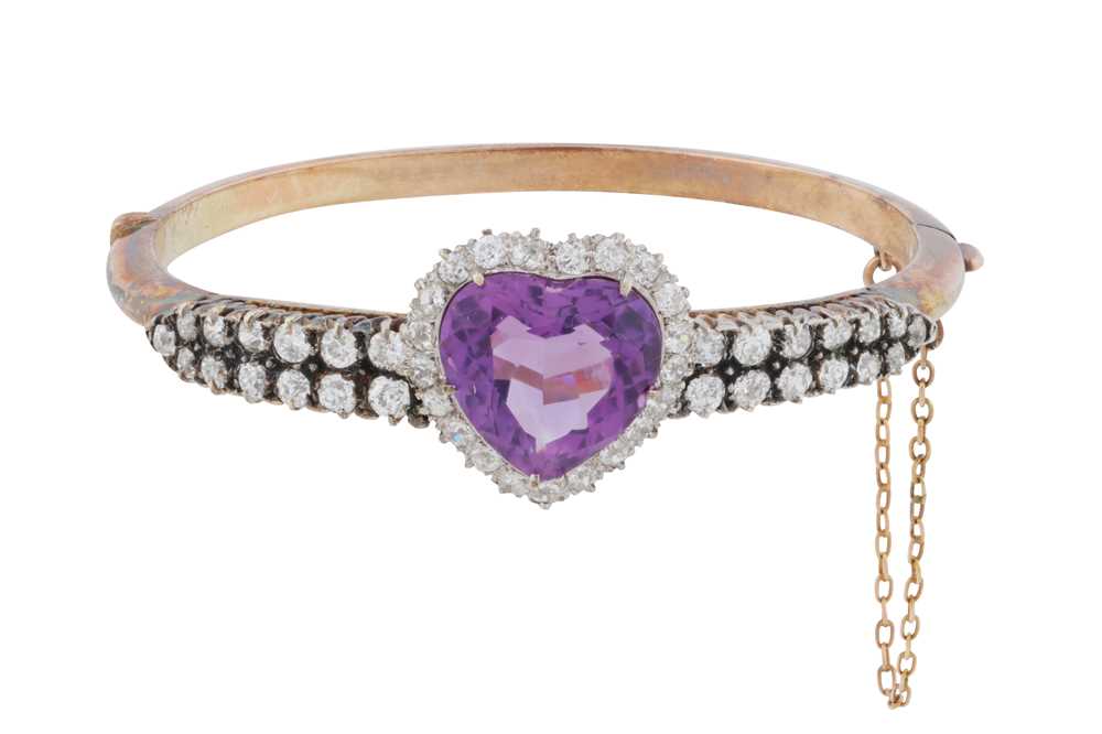 Lot 19 - An amethyst and diamond bangle