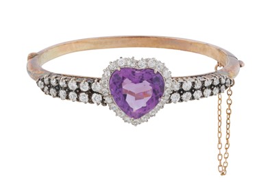 Lot 19 - An amethyst and diamond bangle