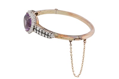 Lot 19 - An amethyst and diamond bangle