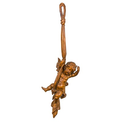 Lot 63 - An Italian carved wood cherub or putto
