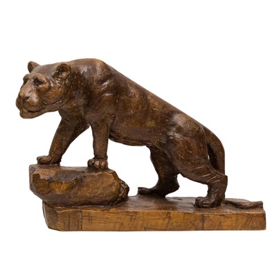 Lot 165 - A carved wood figure of a lioness