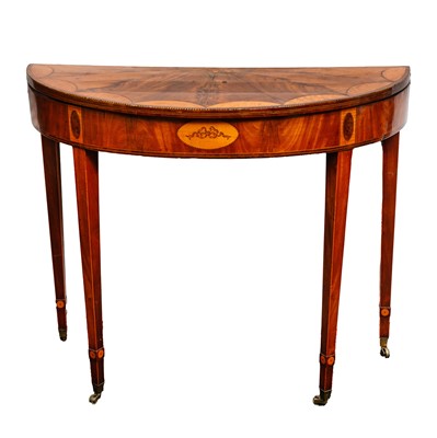 Lot 299 - A George III and later inlaid mahogany turnover card table