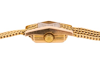 Lot 446 - Lady's Omega 18k Gold Bracelet Watch