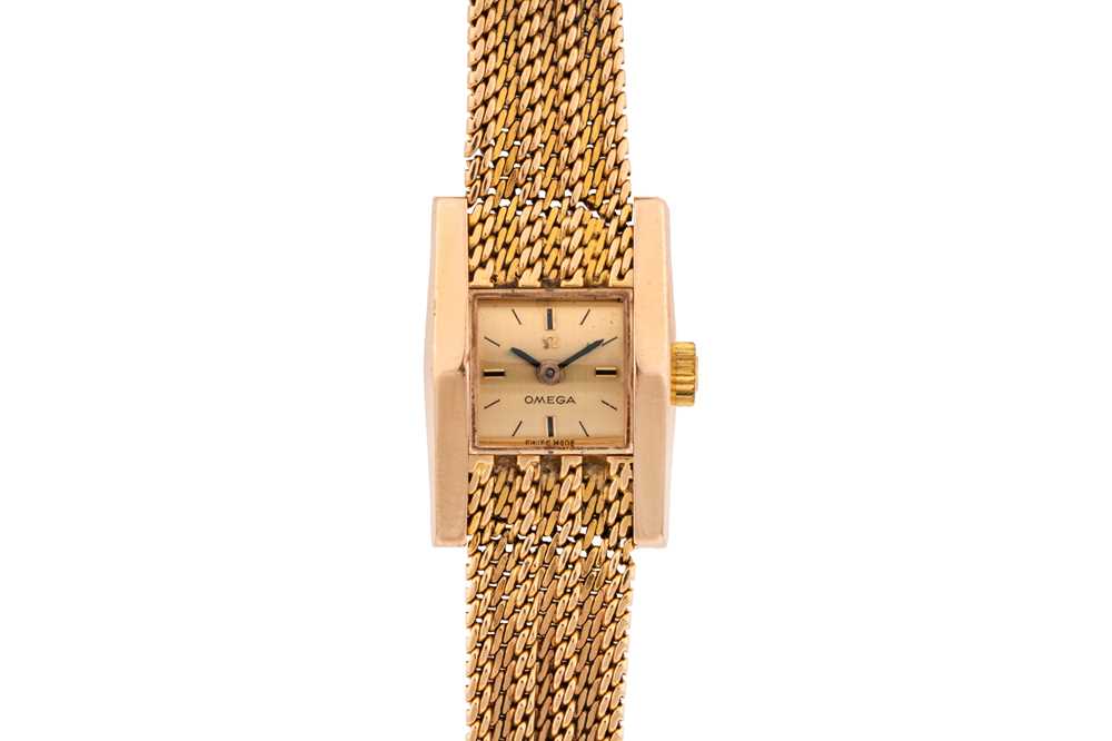 Lot 446 - Lady's Omega 18k Gold Bracelet Watch
