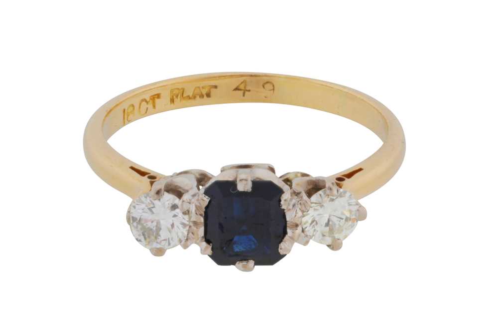 Lot 57 - A sapphire and diamond three-stone ring