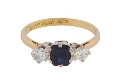 Lot 57 - A sapphire and diamond three-stone ring