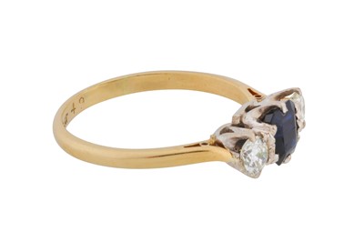 Lot 57 - A sapphire and diamond three-stone ring