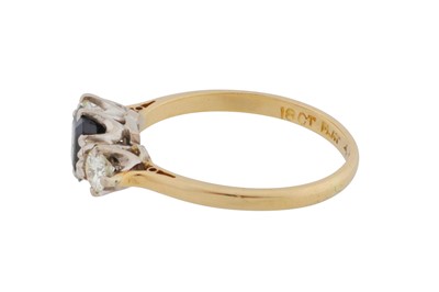 Lot 57 - A sapphire and diamond three-stone ring