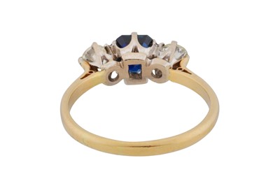 Lot 57 - A sapphire and diamond three-stone ring