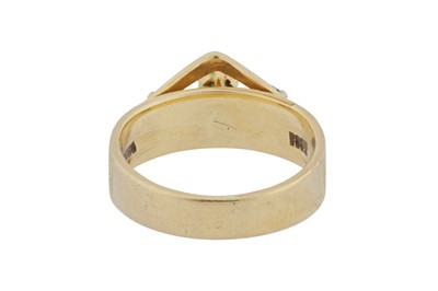 Lot 84 - An emerald and diamond three-stone ring