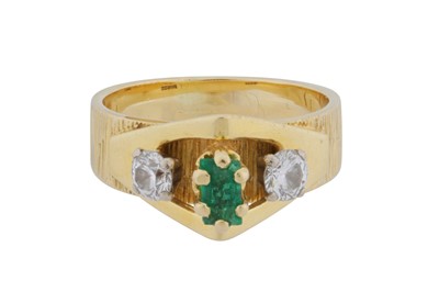 Lot 84 - An emerald and diamond three-stone ring