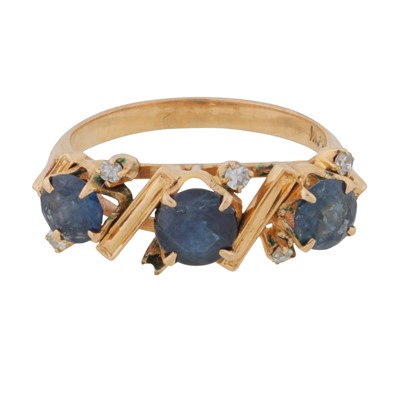 Lot 74 - A sapphire and diamond three stone ring