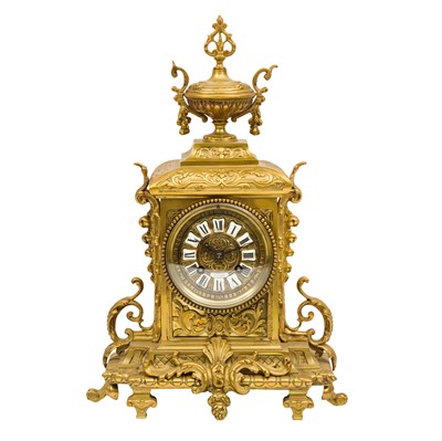 Lot 225 - A French Louis XV style brass mantel clock