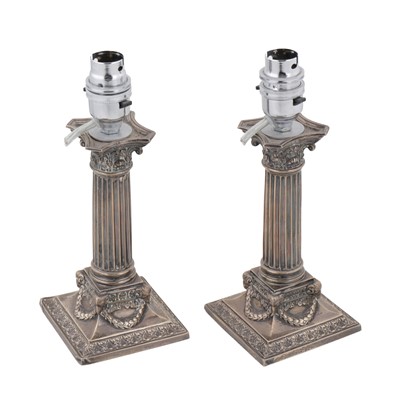 Lot 544 - A pair of Victorian sterling silver dwarf or desk candlesticks, Sheffield 1897 by Martin, Hall and Co