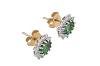 Lot 86 - A pair of tsavorite garnet and diamond cluster earrings