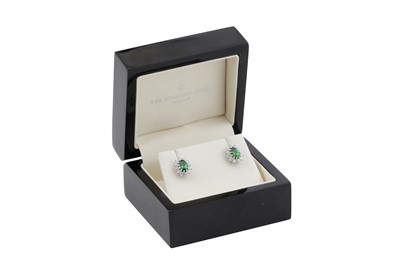 Lot 86 - A pair of tsavorite garnet and diamond cluster earrings