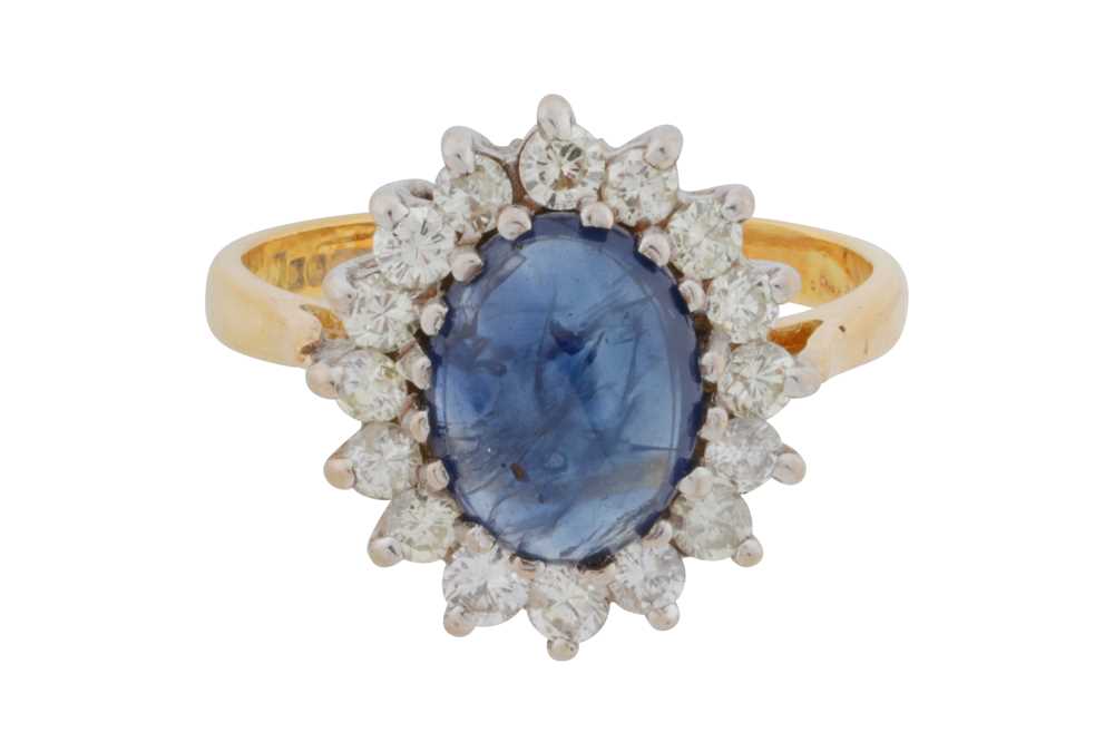Lot 61 - A sapphire and diamond cluster ring, circa 1988