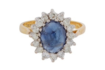 Lot 61 - A sapphire and diamond cluster ring, circa 1988