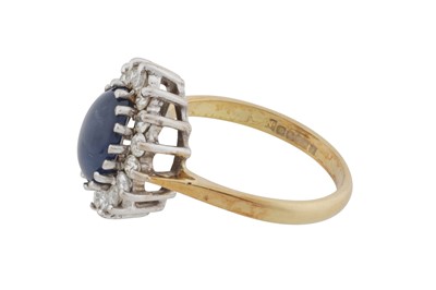 Lot 61 - A sapphire and diamond cluster ring, circa 1988