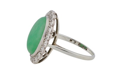 Lot 87 - A jade and diamond cluster ring