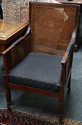 Lot 137 - A pair of mahogany bergere elbow chairs,...